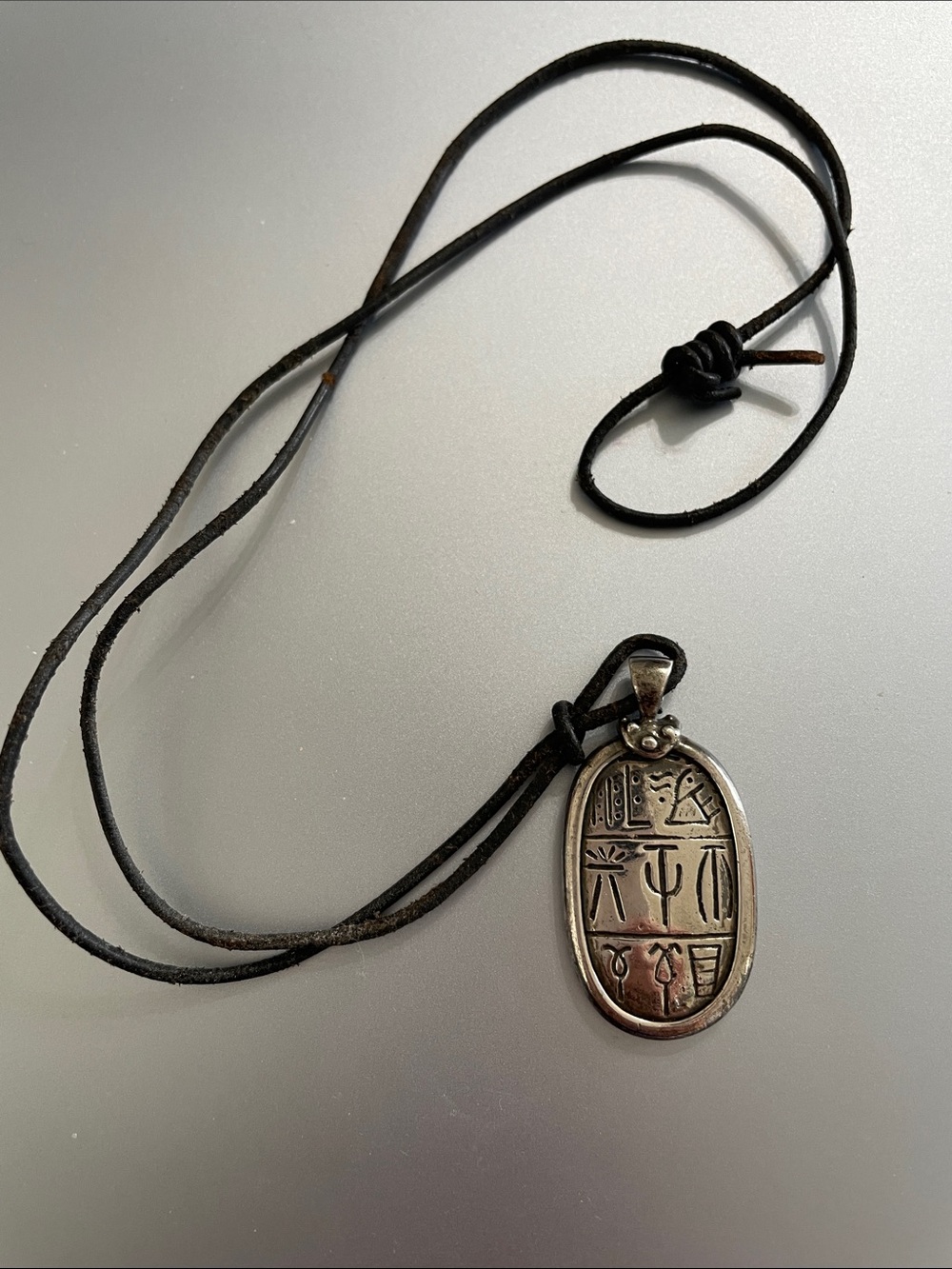 Ancient symbols on Sterling Silver on Black leather Cord 22”
